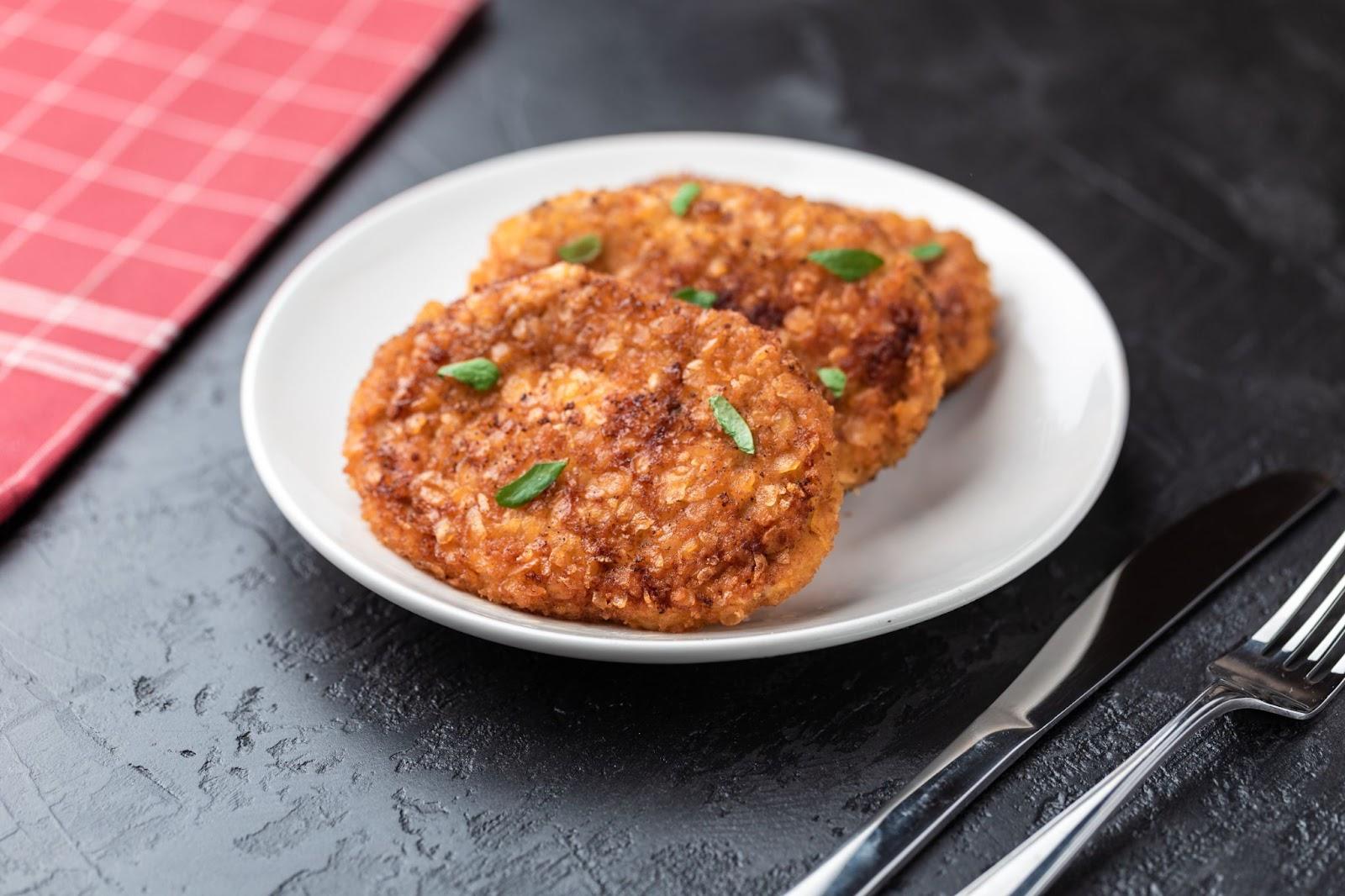 bake chicken cutlets till light brown and served with garnished herbs