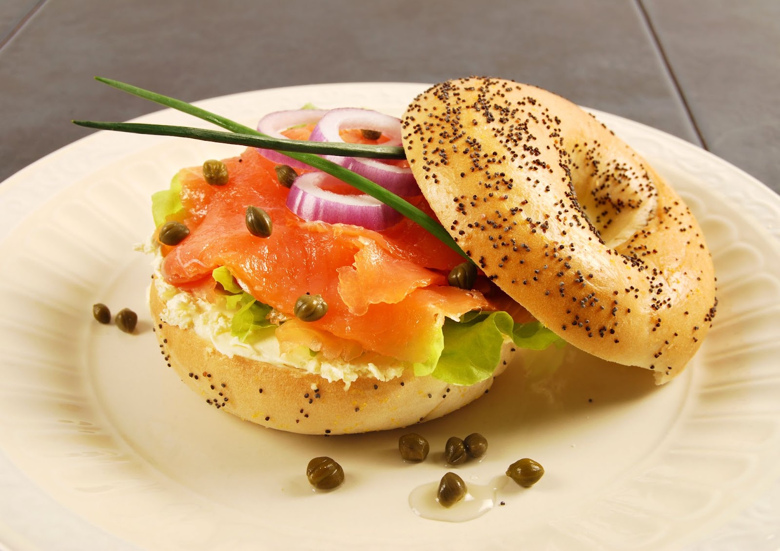 Kaiser Roll sandwich being served in a white plate