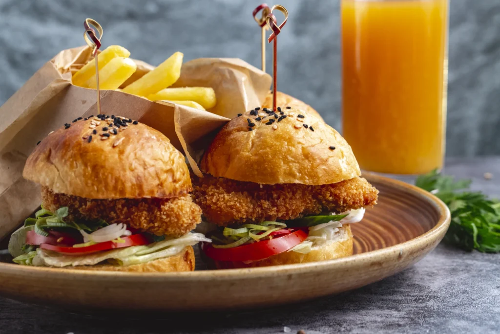 cutlets sliders being served in a plate along with fries
