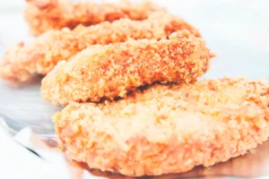 breaded cutlets resting in plate