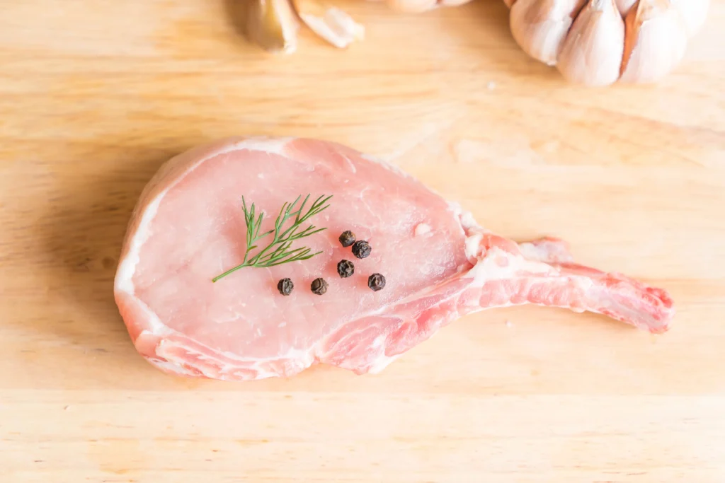 pork chops on wooden table