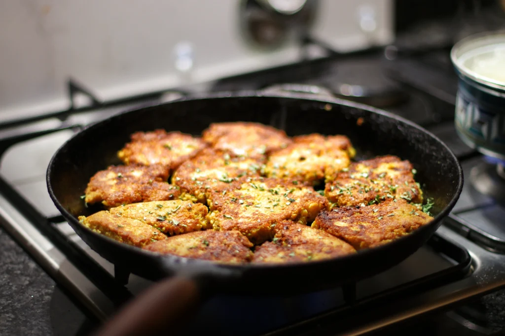 over crowded pan with cutlets