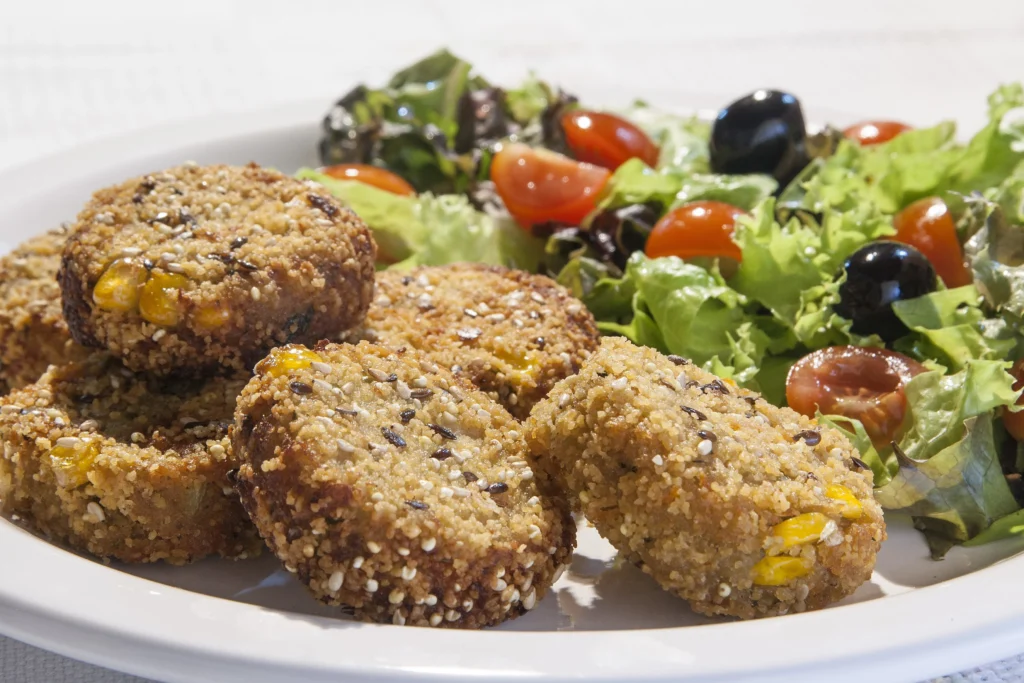 lentils cutlets being served in a plate with salad