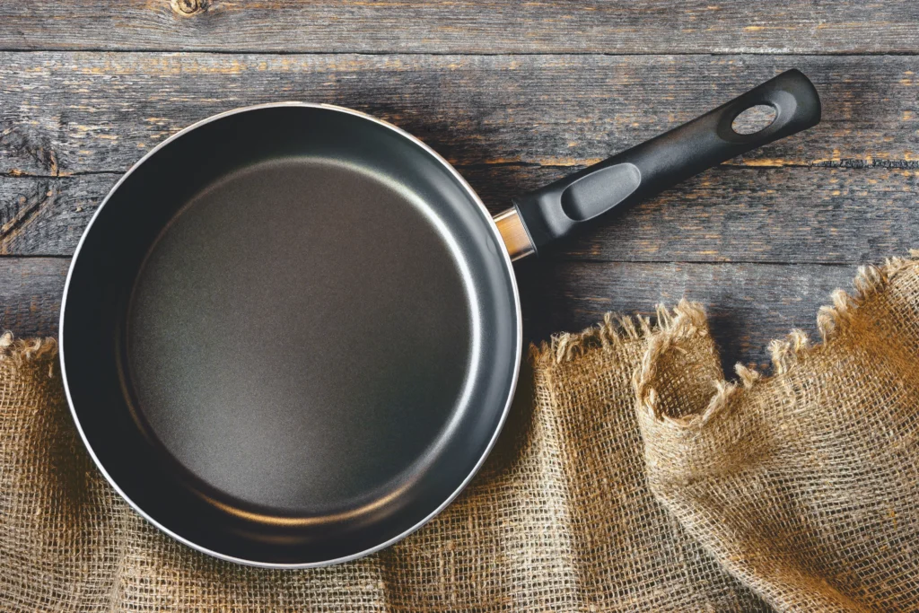 frying pan on a wooden table