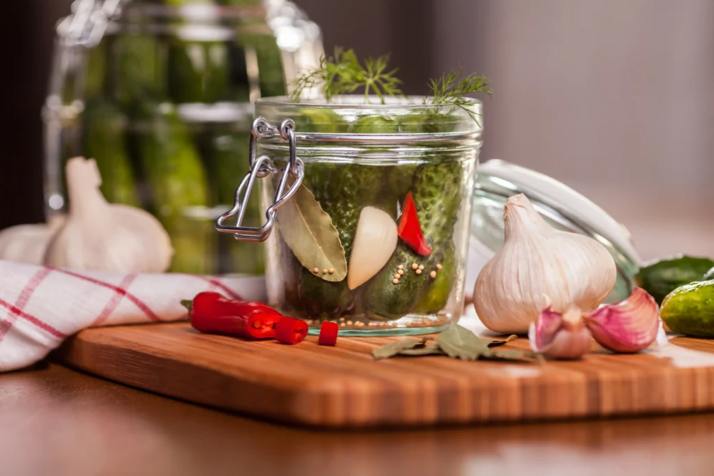 garlic, red chillies and jallepeno pickles in a jar