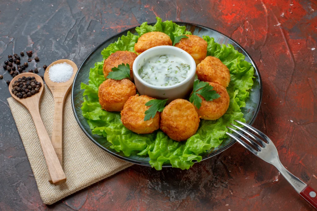 Golden cutlets bites with green dip