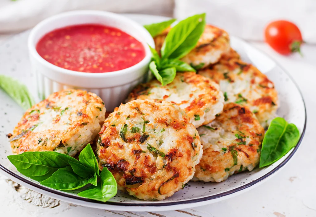 herb chicken cutlets served with red sauce
