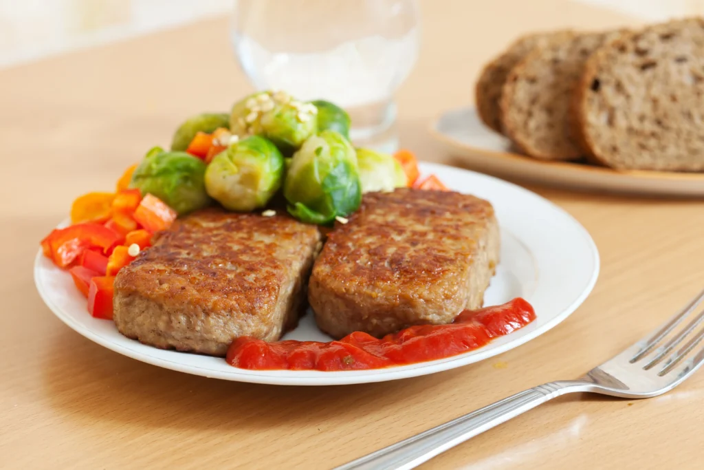 Pork cutlets with vegetables and sauce