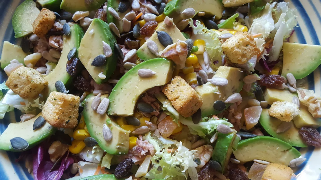 avocado salad with corn served in a bowl