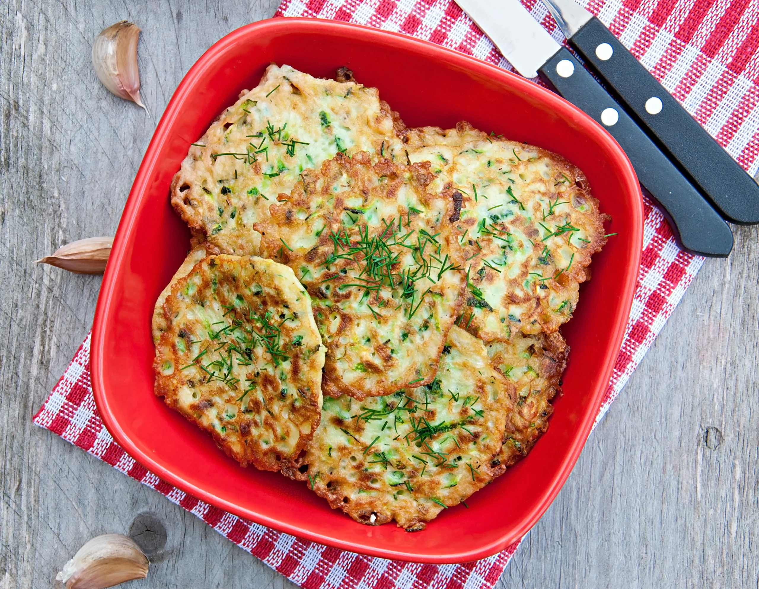 garlic parmesan chicken cutlets served in a red bowl